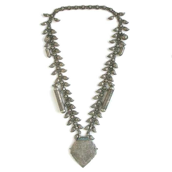Silver necklace with leaf shaped charms and geometric pendant