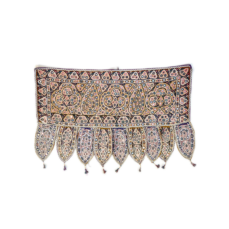 Colorful Indian door hanging with pieces of mirror, multicolored embroidery and tassels