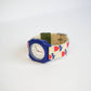 Colorful watch with a patterned strap on a white background