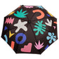 Colorful umbrella with abstract patterns on a black background