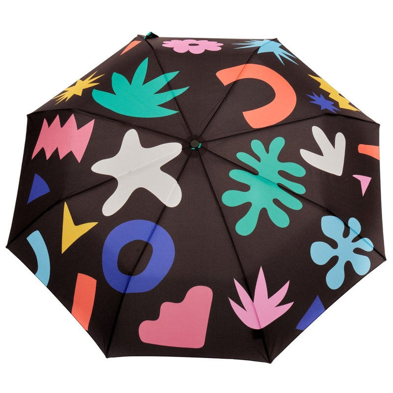 Colorful umbrella with abstract patterns on a black background