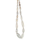A strand of oval shaped white agate beads