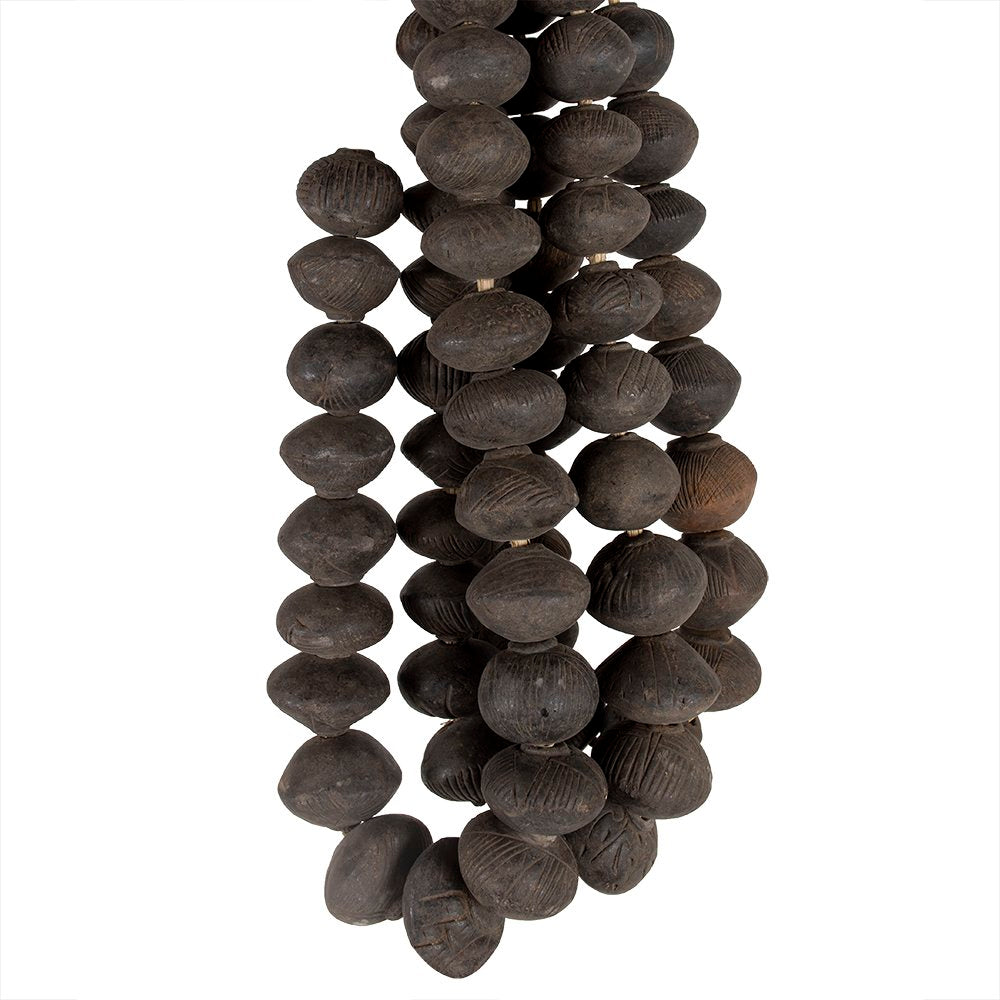 Strands of round clay beads