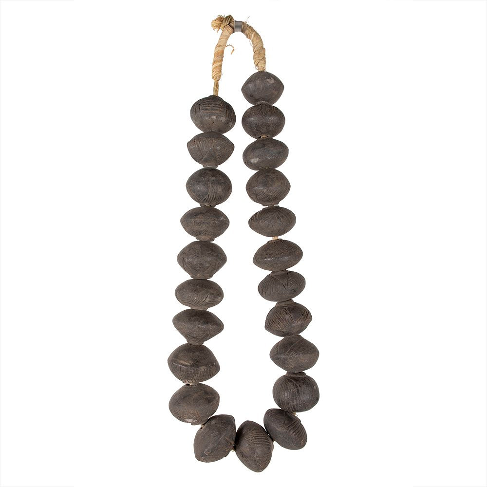 A strand of round clay beads