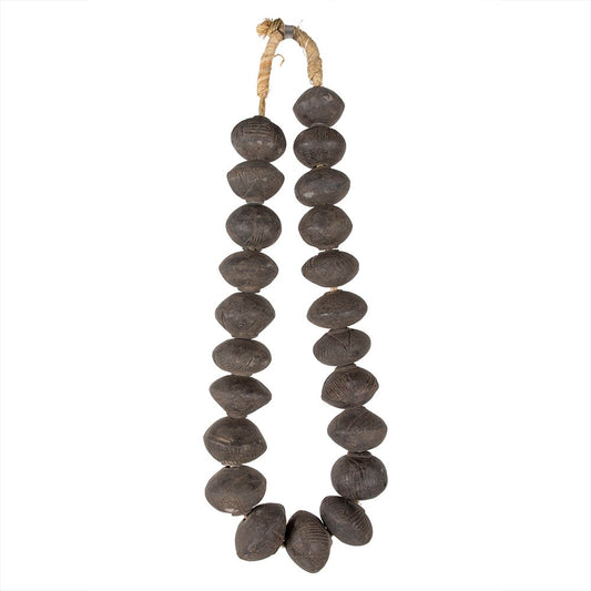 A strand of round clay beads