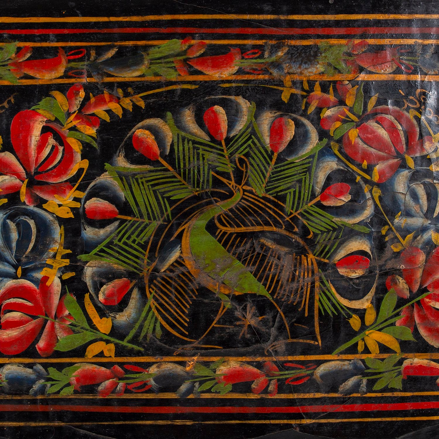 Black lacquerware tray with colorful painted peacock and flowers, close up