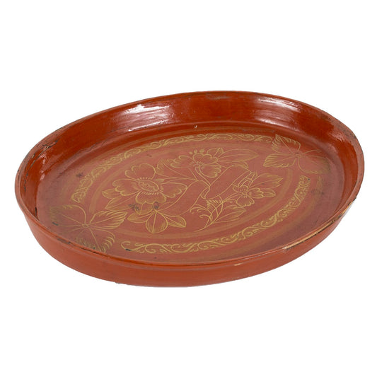 Red lacquerware dish with gold painted flowers, side view