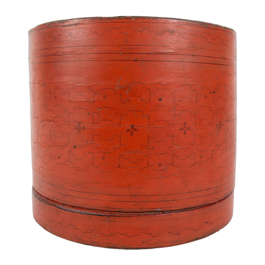 Red lacquerware cylinder shaped offering basket, side view