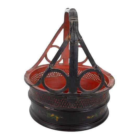 Round lacquerware basket with handle. Red on the inside and black on the outside, side view