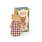 Stuffed bear toy in a checkered dress with packaging displaying 'Bèbe Emile' on a white background