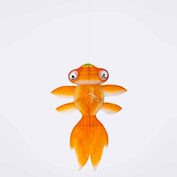 Toy goldfish with a white background