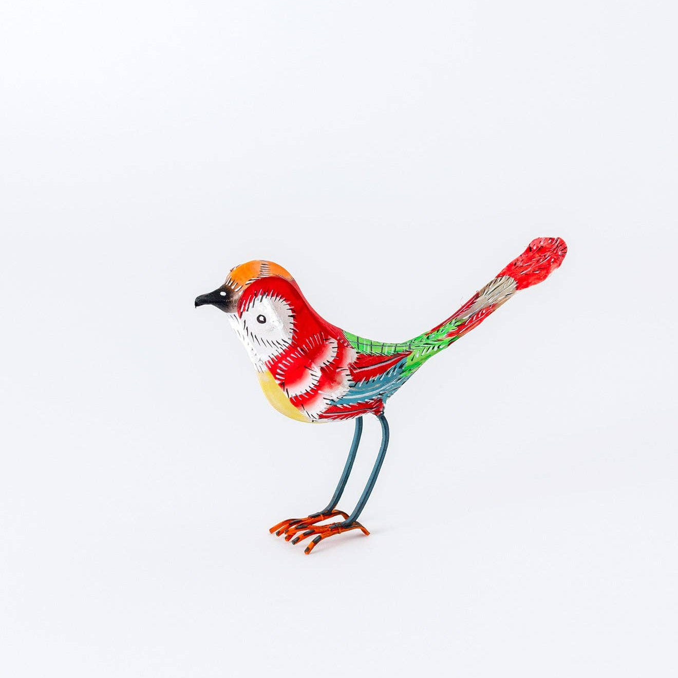 Colorful bird figurine on a white background