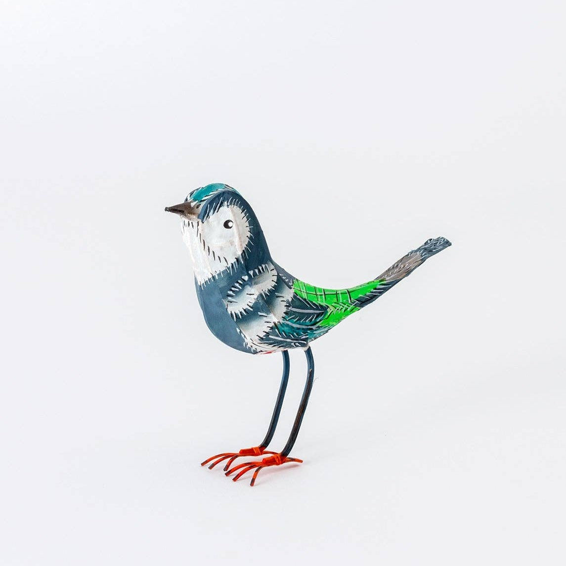 Colorful bird figurine on a white background