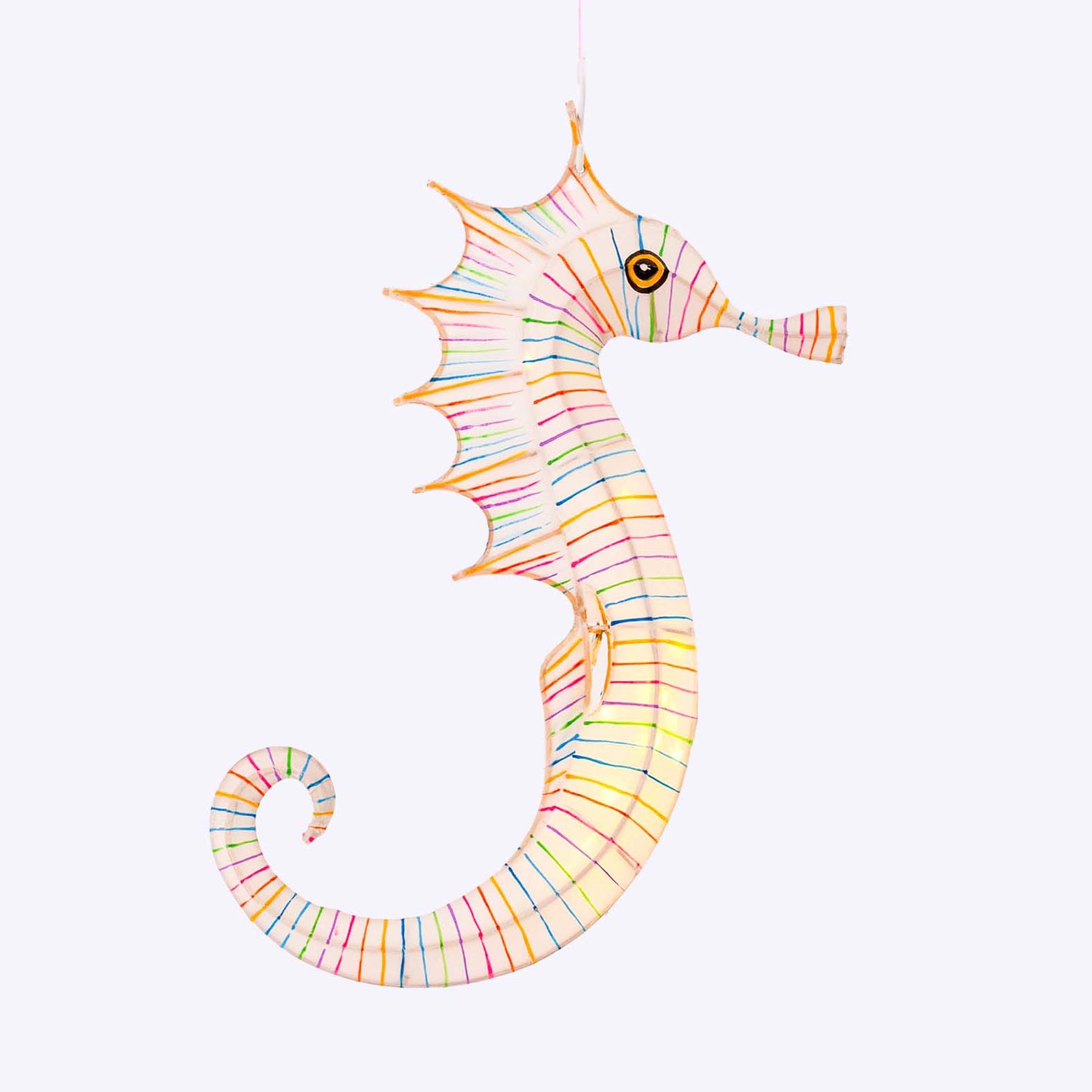 Colorful striped seahorse toy on a white background