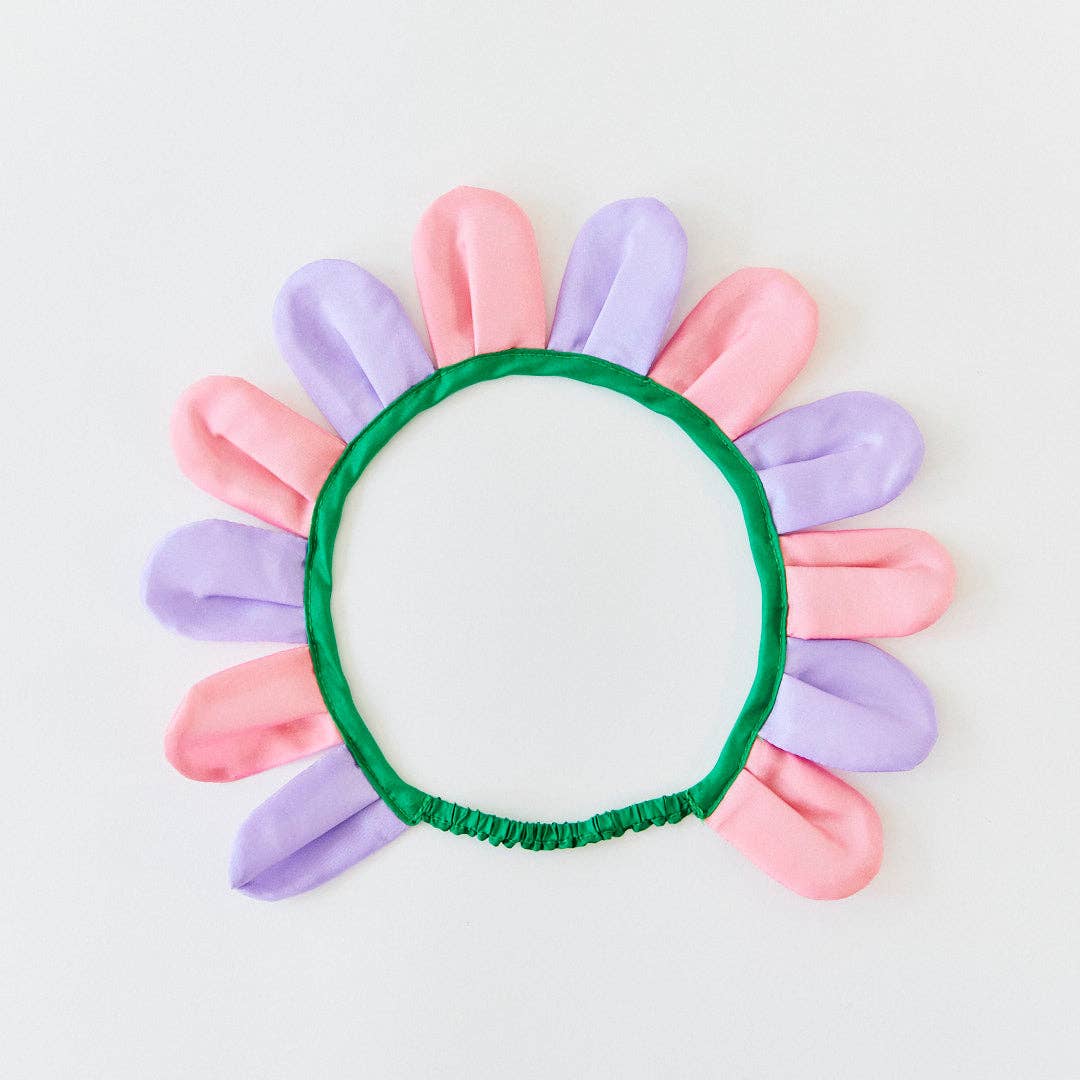 Colorful flower-shaped headband on a light gray background
