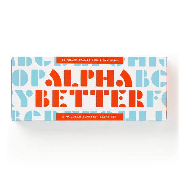 A rectangular product box for an alphabet stamp set, featuring the words 'ALPHA BETTER' in large orange letters over a white background with light blue repeating letters. Orange banners at the top and bottom read '24 SHAPE STAMPS AND 2 INK PADS' and 'A MODULAR ALPHABET STAMP SET'.
