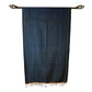 Cotton indigo colored batak with subtle stripe pattern, orange trim and black tassels