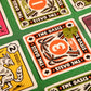 Close-up of playing cards with 'The Oasis' design on a green fabric background