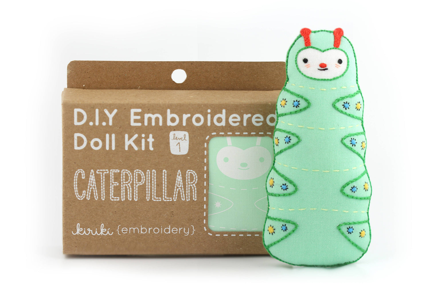D.I.Y. Embroidered Doll Kit for a caterpillar with a cardboard packaging on a white background.