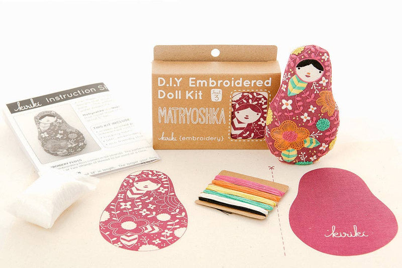 D.I.Y. Embroidered Doll Kit with materials on a white background