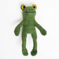 Green frog-shaped toy on a white background