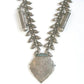 Silver necklace with leaf shaped charms and geometric pendant