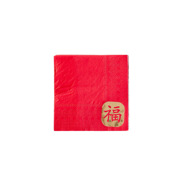 Red napkin with a gold emblem on a white background
