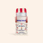 Dr. Max's Nipple Balm in a red and white striped container on a beige background