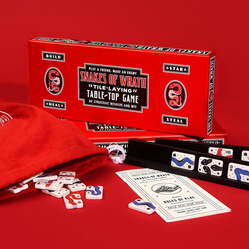 Snake of Wrath tabletop game components on a red background