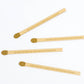 Four wooden sticks with engraved text on a white background