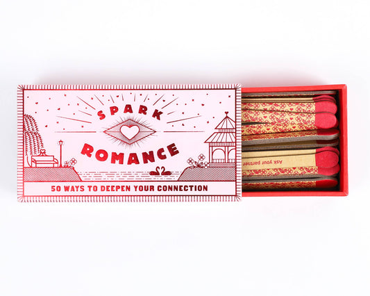 Matchbook with 'Spark Romance' design and matches on a white background