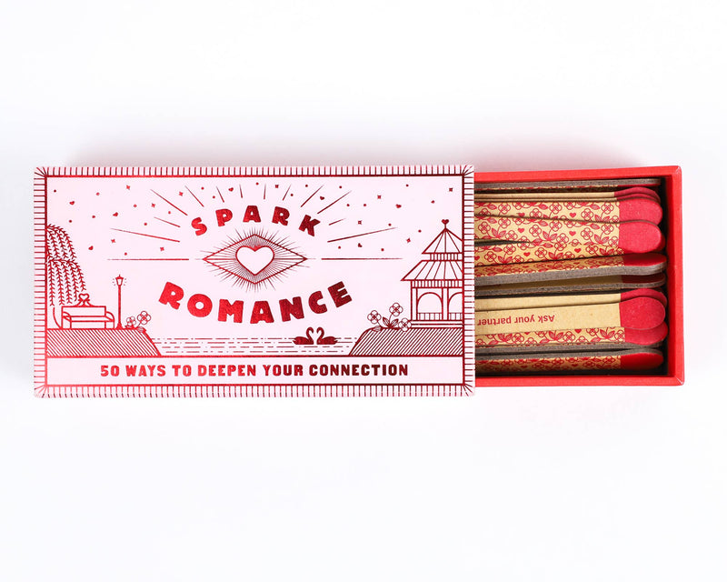 Matchbook with 'Spark Romance' design and matches on a white background