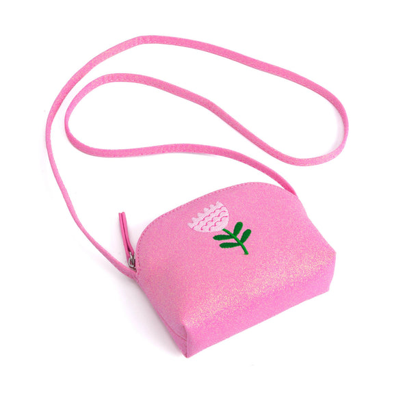 Pink glittery pouch with floral design on a white background