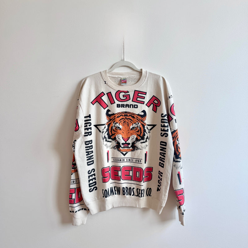 White sweatshirt with tiger branding on a white background