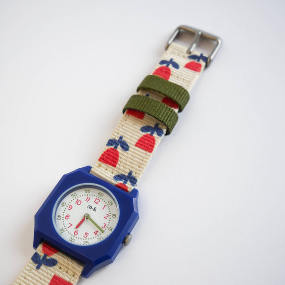 Children's watch with a colorful strap on a white background