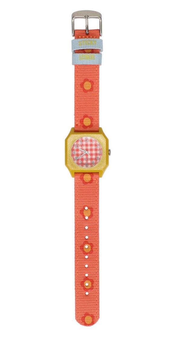 Children's watch with a red strap and gold case on a white background