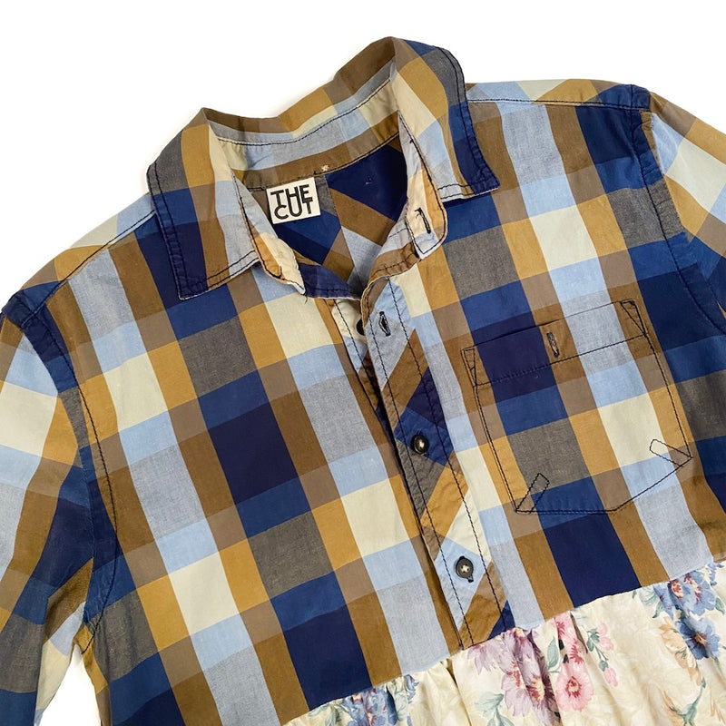 Plaid top of a dress with visible brand logo, the cut on a white background