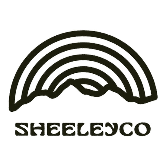 Black logo with a stylized mountain and 'SHEELEYCO' text on a white background.