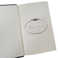 Open book with a circular drawing and signed by doris lessing written inside on a white background