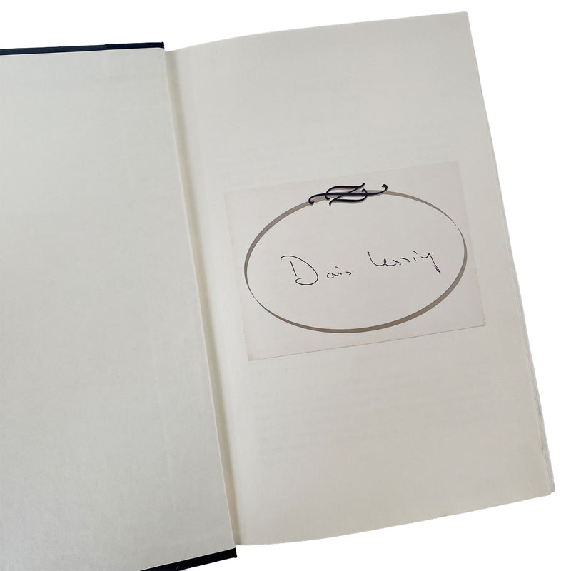 Open book with a circular drawing and signed by doris lessing written inside on a white background