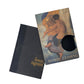 Two books, one black and one with a colorful cover featuring an illustration of two people embracing, on a white background.