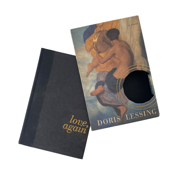 Two books, one black and one with a colorful cover featuring an illustration of two people embracing, on a white background.