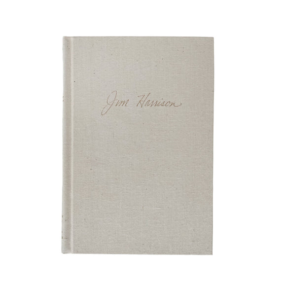 Beige textured book with 'Jim Harrison' inscription on a white background