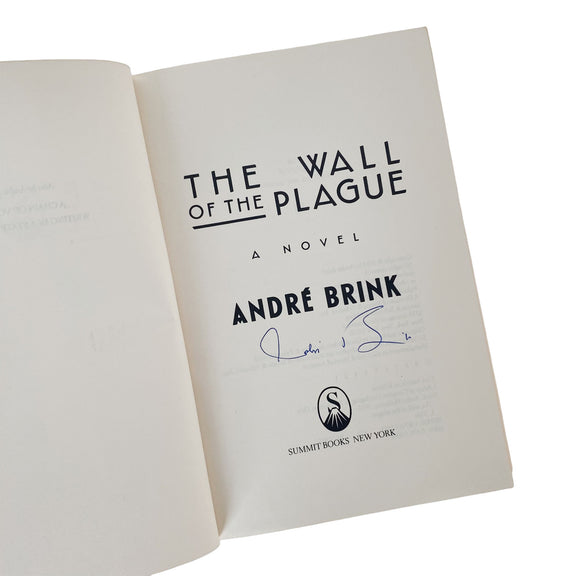 Open book with 'The Wall of the Plague' Signed by André Brink on a white background