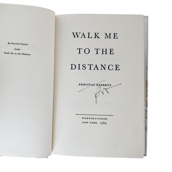 Open book with title 'Walk Me to the Distance' signed by Percival Everett on a white background