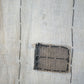 Vintage Japanese boro with vertical line pattern and indigo colored patchwork, close up
